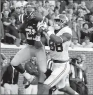  ?? AP/ROGELIO V. SOLIS ?? Mississipp­i defensive back Senquez Golson (21) intercepts a pass intended for Alabama tight end O.J. Howard to cap the Rebels’ comeback victory.