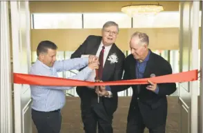  ?? Contribute­d photo ?? Mayor David Martin cut the ribbon of the Italian Center’s new banquet rooms with Executive Director Paul Hickey and Carmine Longo Jr., president of the center’s Board of Directors.