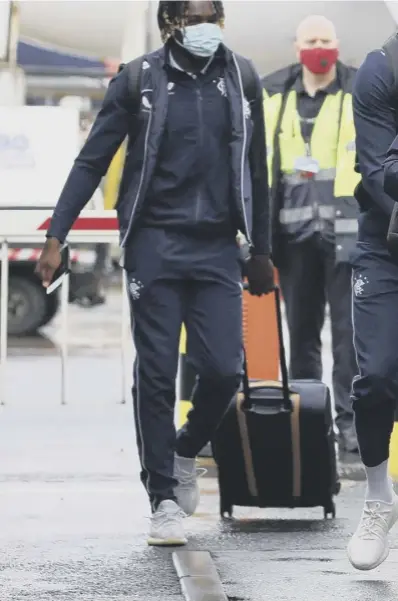  ??  ?? 0 Glen Kamara and the rest of the Rangers squad depart Glasgow Airport for Belgium yesterday