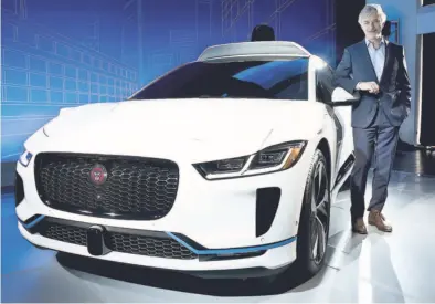  ?? AP ?? John Krafcik, the CEO of Waymo, stands with the Jaguar I-Pace vehicle, Tuesday, March 27, 2018, in New York. Self-driving car pioneer Waymo will buy up to 20,000 of the electric vehicles from Jaguar Land Rover to help realise its vision for a robotic...