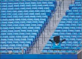  ?? Chris Carlson The Associated Press ?? The Panthers mascot performs Wednesday in an empty Bank of America Stadium. The Panthers won’t have fans in the stands for their opener against the Raiders.