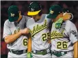  ?? JAYNE KAMIN-ONCEA — GETTY IMAGES ?? The A’s Stephen Piscotty is helped off the field by by manager Bob Melvin (6) and Matt Chapman after spraining his right knee last season.