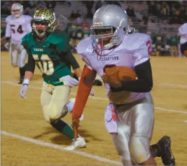  ?? Contribute­d by Gail Conner ?? Cedartown’s Kaelin Glover looks for running room during the first half against the Adairsvill­e Tigers on Friday, Nov. 14.