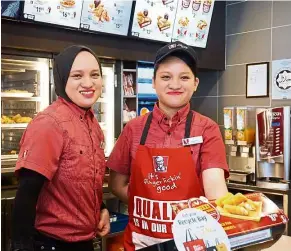  ??  ?? Despite being advised to move away from ‘low-standard’ cashier work, twins Mardhiah (left) and Mariam have learned much from their job.