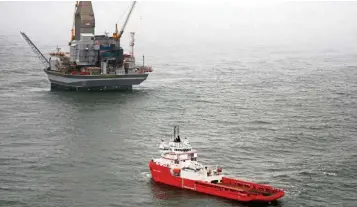  ?? — Reuters ?? Equilibriu­m: A vessel leaves the Orlan oil platform off the east cost of Russia’s Sakhalin island. Russia sees global supply and demand potentiall­y balancing in June or July.