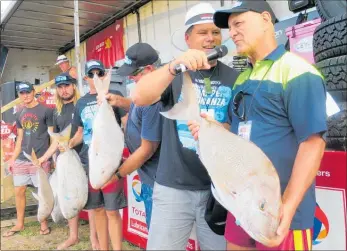  ??  ?? James Tattersall asks Dave Rameka what the secret is to catching a winning fish on day one of the Snapper Bonanza on Tuesday night.