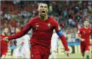  ?? FRANCISCO SECO — THE ASSOCIATED PRESS ?? Portugal’s Cristiano Ronaldo celebrates his side’s opening goal during the group B match between Portugal and Spain at the 2018 soccer World Cup in the Fisht Stadium in Sochi, Russia, Friday.