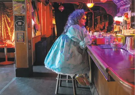  ?? Josie Norris / The Chronicle 2009 ?? Vivvyanne ForeverMOR­E, above, sits at the bar at the Stud in 2009. The Stud has been a staple of queer nightlife in San Francisco for more than 50 years and is now dark.