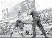  ?? Harry How Getty I mages ?? GENNADY GOLOVKIN works with longtime trainer Abel Sanchez before a f ight in August.