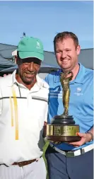  ?? ?? The overall champion of this year’s Knysna Golf Club club championsh­ip, Anthony Parker (right) and his caddie, Maurice May.