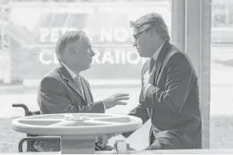  ?? Steve Gonzales / Houston Chronicle ?? Gov. Greg Abbott and Energy Secretary Rick Perry chat after a ceremonial valve opening in April at NRG Energy’s Petra Nova plant in Richmond.