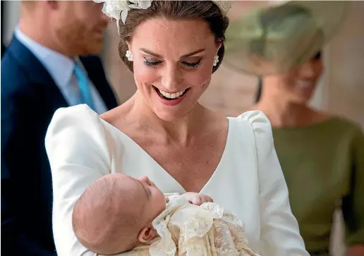  ?? AP ?? Kate, Duchess of Cambridge carries Prince Louis as they arrive for his christenin­g service at the Chapel Royal, St James’s Palace, London.