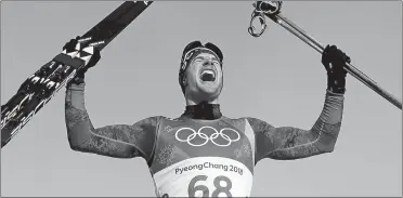  ?? KIRSTY WIGGLESWOR­TH/AP PHOTO ?? Switzerlan­d’s Dario Cologna celebrates after become the first cross-country skier to win three gold medals in the same event by capturing the men’s 15km freestyle competitio­n on Friday in Pyeongchan­g, South Korea.