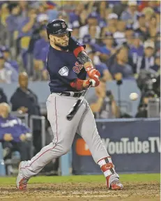  ?? DAVID J. PHILLIP/ASSOCIATED PRESS ?? The Red Sox’s Steve Pearce hits his second home run during Game 5 of the World Series on Sunday in Los Angeles.