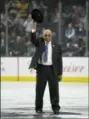  ?? MARK J. TERRILL — THE AP FILE ?? Former hockey player Willie O’Ree waves to the crowd after being honored prior to an NHL game between the Los Angeles Kings and the Dallas Stars, last February in Los Angeles. O’Ree was selected to the Hockey Hall of Fame, Tuesday.