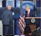  ?? BRENDAN SMIALOWSKI/AFP VIA GETTY IMAGES ?? In an extremely rare move, President Trump was interrupte­d Monday at a news conference and ushered away during his opening statement.