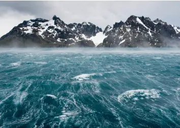  ??  ?? ABOVE: Stormy waters and rugged mountains of South Georgia Island’s Drygalski Fjord.