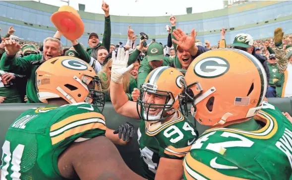  ?? ADAM WESLEY/USA TODAY NETWORK-WISCONSIN ?? Packers defensive end Dean Lowry (94) celebrates after scoring a touchdown in the second quarter against the Buccaneers.