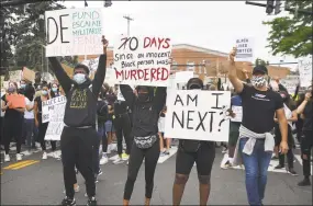  ?? Brian A. Pounds / Hearst Connecticu­t Media ?? Protestors block traffic on the Post Road during an organized Black Lives Matter police brutality protest in Fairfield on Tuesday.