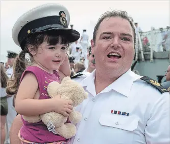  ?? ANDREW VAUGHAN THE CANADIAN PRESS ?? Petty Officer Second Class Robert Sinclair holds daughter Harper, as HMCS St. John’s returns to port in Halifax on Monday. The ship and crew were participat­ing in Operation Reassuranc­e, which aims to reinforce NATO’s collective defence. Exercises took...