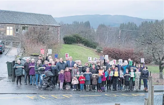  ??  ?? Parents, children and politician­s came together in a show of support for Logierait Primary School, whose future is in doubt.