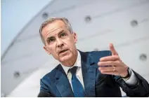  ?? CHRIS J RATCLIFFE
THE ASSOCIATED PRESS ?? The Bank of England headed by Governor Mark Carney says prolonged uncertaint­y would further weigh on economic growth.
