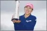  ?? Associated Press photo ?? Korea's In-Kyung Kim celebrates her victory with the trophy after her final round of the 2017 Women's British Open at Kingsbarns Golf Links, St Andrews, Scotland, Sunday.