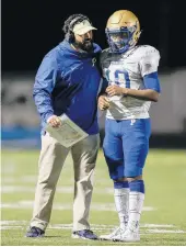  ?? JOHN SUDBRINK/FREELANCE FILE ?? Phoebus head coach Jeremy Blunt, seen here with quarterbac­k Chris Daniels, realizes this is “the new normal.”