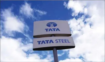  ?? OLI SCARFF/AFP ?? A Tata Steel logo outide the entrance to the Brinsworth Strip Mill, operated by Tata Steel, in Rotherham, northern England.