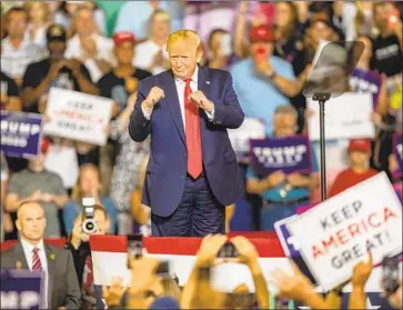  ?? Travis Long (Raleigh, N.C.) News & Observer ?? PRESIDENT TRUMP’S July 17 rally in Greenville, N.C., where thousands chanted, “Send her back!” in reference to Rep. Ilhan Omar. The naturalize­d citizen is one of four outspoken, nonwhite women he has targeted.