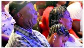  ??  ?? Dufton’s parents, Cas (father) and B (mother), sit with his niece, Sapphire, as they enjoy the show.