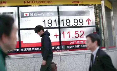  ??  ?? Asian markets rallied and the dollar sank on Thursday. (AFP)