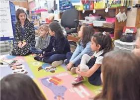  ??  ?? Julianne Belsito leads her kindergart­en class in a morning meeting at Helen I. Smith Elementary School, which uses mindfulnes­s programs in its curriculum.