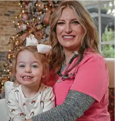  ?? Steve Gonzales / Staff photograph­er ?? Dr. Kristina Braly is shown with her daughter, Harper, 3. She says medical personnel are better prepared in the new surge.