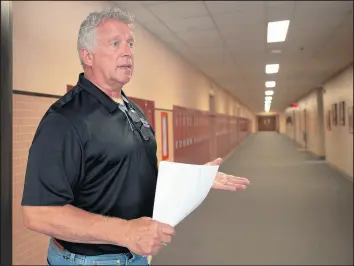  ?? KYLE TELECHAN/POST-TRIBUNE ?? Merrillvil­le Community Schools security chief Brad Best speaks in August about measures taken to address potential security situations. A bill in the legislatur­e would allow school districts to offer voters a referendum to pay for security.