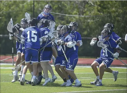  ?? PETE BANNAN — MNG FILE ?? Kennett players swamp goalie Jason Astle as time expires in a win over Wissahicko­n earlier in the PIAA playoffs.