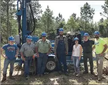  ??  ?? Special to the Democrat-Gazette/KIM TYLER Stewart Pickering (left), Rodney Castleberr­y, Tim Tyler, Ethan Tyler, Angelyn McMurray of We Are FREE, Jason Riddle and Ben Temple stand tall during the first of two days of drilling the well for We Are FREE’s after-care facility in southwest Arkansas. The 25-acre patch of land will eventually hold medical and counseling offices, a group home and space for activities and education.