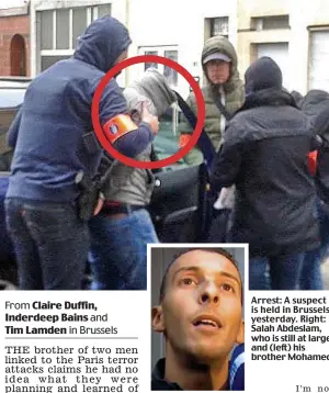  ??  ?? Arrest: A suspect is held in Brussels yesterday. Right: Salah Abdeslam, who is still at large, and (left) his brother Mohamed