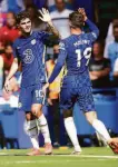  ?? Tess Derry / Associated Press ?? Midfielder Christian Pulisic (left) celebrates his goal in Chelsea’s 3-0 win.