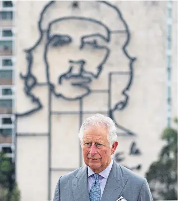  ??  ?? Prince Charles, backed by Che Guevara, at a ceremony in Havana, Cuba, yesterday as part of a 13-day royal tour of the Caribbean