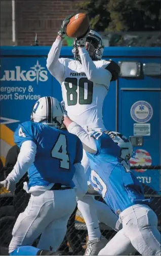  ?? GENE WALSH — DIGITAL FIRST MEDIA ?? Pennridge’s Connor Pleibel jumps for a pass to score a touchdown as Quakertown’s Delbert Ross defends during their game Thursday.