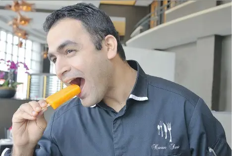  ??  ?? Karan Suri, executive chef at the Fairmont Waterfront in Vancouver, tries his Carrot, Orange and Basil Popsicle. See recipe at right.