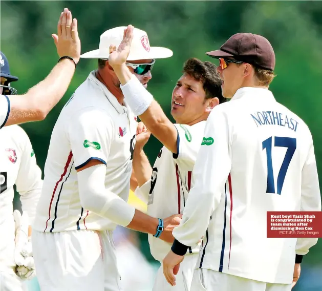  ?? PICTURE: Getty Images ?? Kent boy! Yasir Shah is congratula­ted by team mates after dismissing Ben Cox