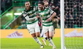  ?? Photograph: Jane Barlow/PA ?? Celtic’s Greg Taylor (right) celebrates with Adam Idah after scoring his side's fifth goal of the game.