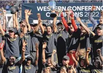  ?? JOHN MCCOY/ ASSOCIATED PRESS ?? Los Angeles FC players celebrate after a playoff win over Austin FC last season. LAFC went on to win the MLS Cup. The 2023 MLS season begins Saturday.