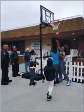  ?? PHOTO COURTESY OF NICK BORGES ?? Seaside Police Deputy Chief Nick Borges went to a sporting goods store and bought a freestandi­ng basketball hoop and some basketball­s for the kids at Del Monte Manor.