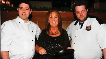  ??  ?? Ardfert National School Principal Betty Stack getting some top kitchen tips from the Tralee Culinary Gangsters Paul Cotter and Noel Keane at the school’s Taste of Christmas fundraiser in the Ballyroe Heights Hotel recently.