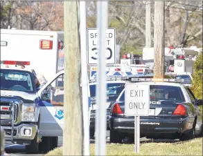  ?? Matthew Brown / Hearst Connecticu­t Media ?? Stamford Police and emergency responders shutdown Newfield Avenue near Trinity Catholic High School on Thursday.Reports of an incident involving an active shooter at a nearby residentia­l home drew a heavy police presence, causing the high school to shelter in place. The initial call was determined to be a hoax, police said.