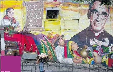  ?? SALVADOR MELENDEZ/ THE ASSOCIATED PRESS ?? A mural of Roman Catholic Archbishop Oscar Romero decorates a wall on a street in Panchimalc­o, El Salvador. Thirty-five years after Romero was assassinat­ed he will be beatified by Pope Francis.