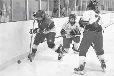  ?? CAROLE MORRIS-UNDERHILL ?? Zoey Rafuse got in a little penalty trouble after knocking over a Flames player to secure the puck.